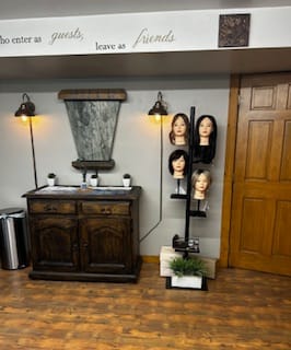 Media Artistry private salon — styling chair, mirror, and comfortable seating